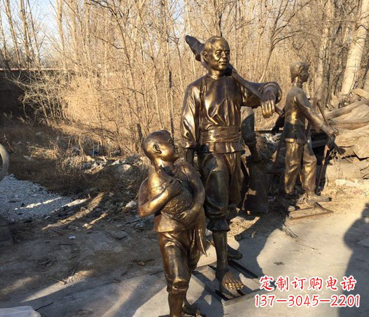 徐州抱着鱼的儿童街边小品铜雕