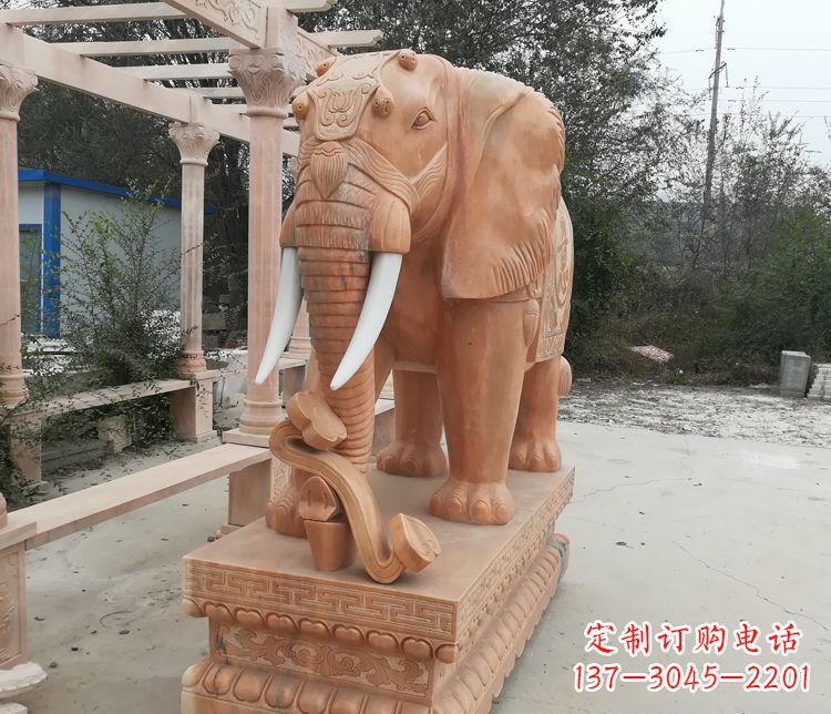 徐州鼻卷如意的大象晚霞红门口镇宅石雕
